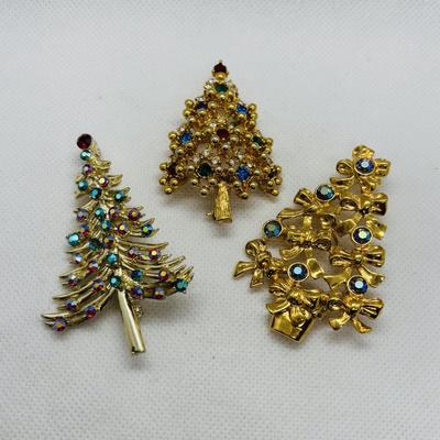 LOT 90: Collection of Holiday Brooches including a Tona Gold Tone Enamel Cornucopia Pumpkin Brooch, Eisenberg Christmas Tree Brooch...