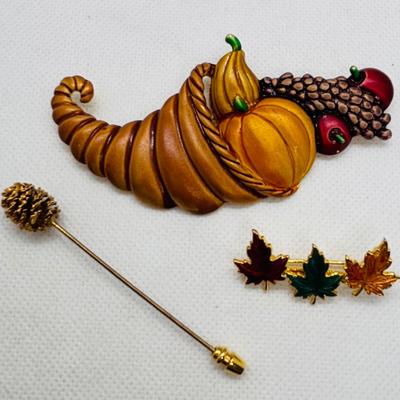 LOT 90: Collection of Holiday Brooches including a Tona Gold Tone Enamel Cornucopia Pumpkin Brooch, Eisenberg Christmas Tree Brooch...