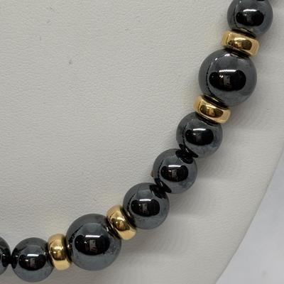 LOT 97: Hematite & Gold Beaded Necklace 14K on Clasp along w/Matching Earrings 14K on Stem