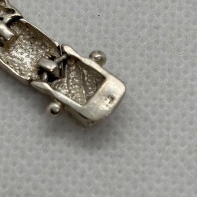 LOT 105: Sterling Silver Hugs & Kissing 7" Bracelet, Onyx Tear Drop Earrings & Avon 925 Blue Topaz Earrings