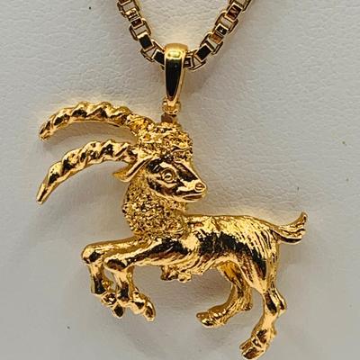 LOT:172: Collection of Goldtone Fashion Jewelry and More Including RER Bererb Ring, Bulls Eye Seed Pendant, Monet Goat Pendant and Chain...