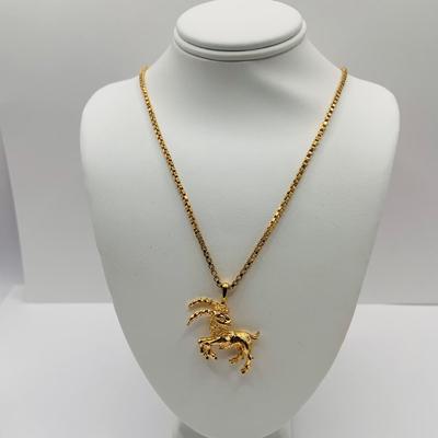 LOT:172: Collection of Goldtone Fashion Jewelry and More Including RER Bererb Ring, Bulls Eye Seed Pendant, Monet Goat Pendant and Chain...