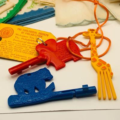 LOT 178: Assortment of Vintage Childrens Jewelry, Kit Gloves, Toys, Games Including Keys to Phildelphia Zoo, Kitty in the Keg Diaper Pins...