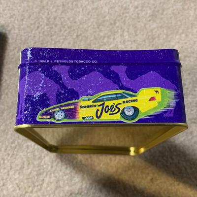 LOT 26 B: Collectible Tin Collection; Smokin' Joe's Racing, Enamel Footed Spinning Candy Tin, & More