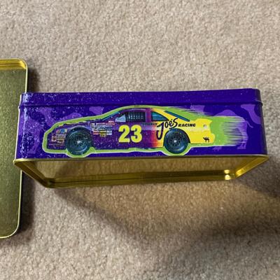 LOT 26 B: Collectible Tin Collection; Smokin' Joe's Racing, Enamel Footed Spinning Candy Tin, & More