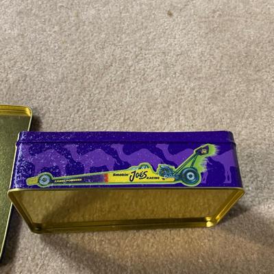 LOT 26 B: Collectible Tin Collection; Smokin' Joe's Racing, Enamel Footed Spinning Candy Tin, & More