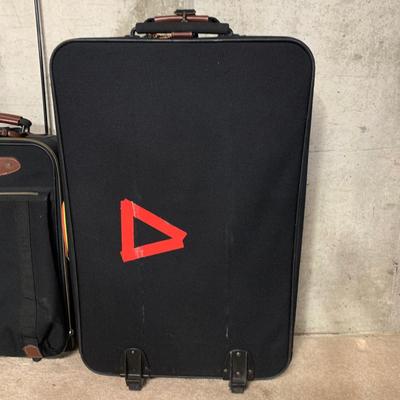 LOT 34 B: American Tourister Suitcases