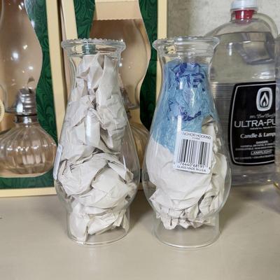 LOT 68B: Boxed Lamplight Farms Glass Oil Lamps, Anchor Hocking Glass Chimney Tops & 3 Bottles of Candle/Lamp Oil