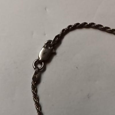 STERLING SILVER CHAIN BRACELET AND RING W/RED STONE THAT IS CHIPPED