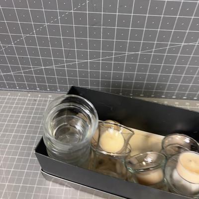 Pile of Clear Votives and Candles