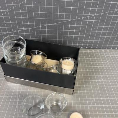 Pile of Clear Votives and Candles