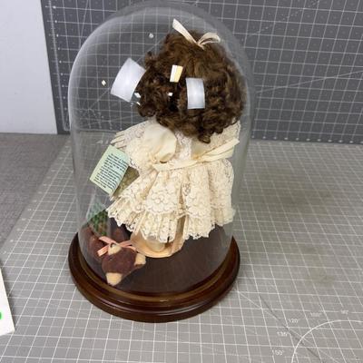 Porcelain Doll under Glass Bell