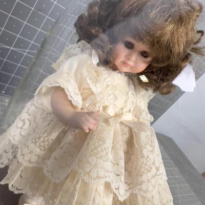 Porcelain Doll under Glass Bell