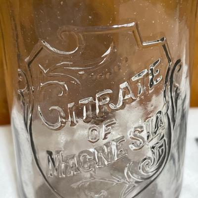 Vintage bottle and small bicycle licenses