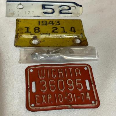 Vintage bottle and small bicycle licenses