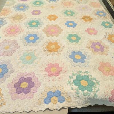 Sale Photo Thumbnail #2805: Pastel prints and solids against a white background;  reverse white.  Scallop edges on tow sides and rimmed with green calico border.  Quilting and condition good