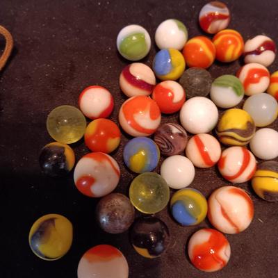 VERY OLD MARBLES AND A LEATHER DRAWSTRING BAG