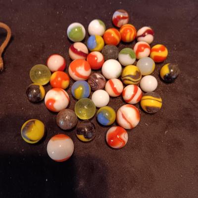 VERY OLD MARBLES AND A LEATHER DRAWSTRING BAG