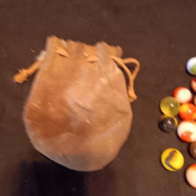 VERY OLD MARBLES AND A LEATHER DRAWSTRING BAG