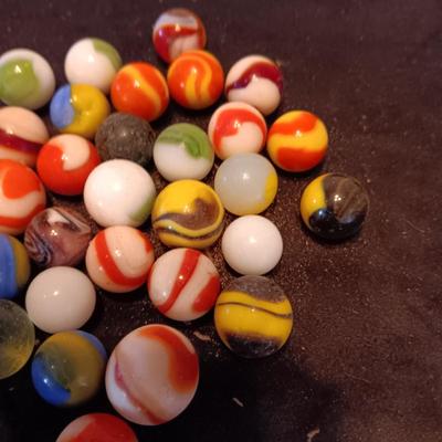 VERY OLD MARBLES AND A LEATHER DRAWSTRING BAG