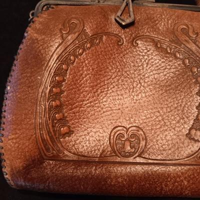 ANTIQUE TOOLED LEATHER PURSE AND A BAKELITE BRUSH