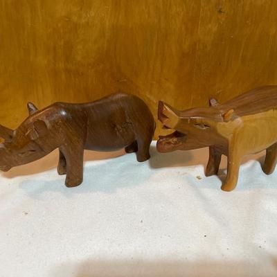 Wood carved rhino and hippo