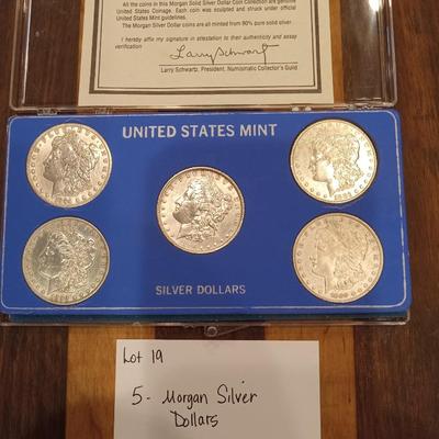 5 Morgan Dollars.