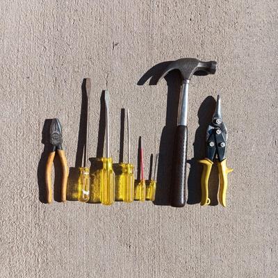 SCREWDRIVERS, WIRE CUTTERS, SNIPS AND A HAMMER