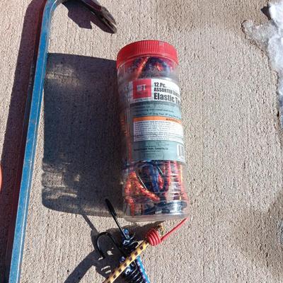 CROW BAR, TROUBLE LIGHT, GAS CAN, BUNGEE CORDS, HEADLIGHT AND ZIP TIES