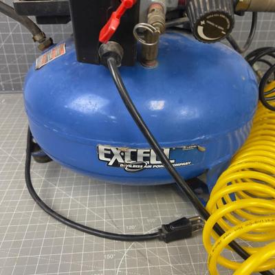 4 Gallon Air Compressor comes with Air Hose. 