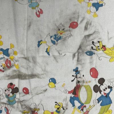 Sale Photo Thumbnail #164: Walt Disney Production label on blanket. Very soft flannel, well loved. There is a large light colored stain on it, but we haven't attempted to clean and it may be something that will come out.