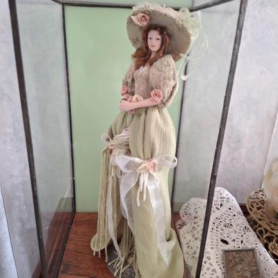 Doll in display case