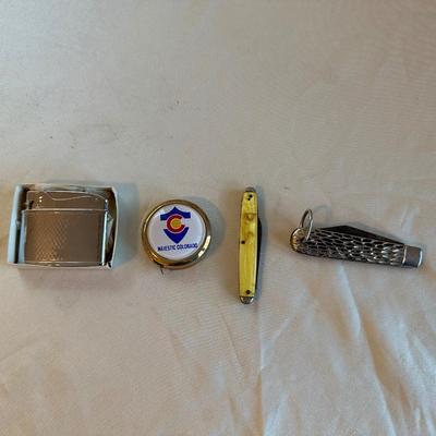 POCKET KNIVES, BUTANE LIGHTER AND A TAPE MEASURE