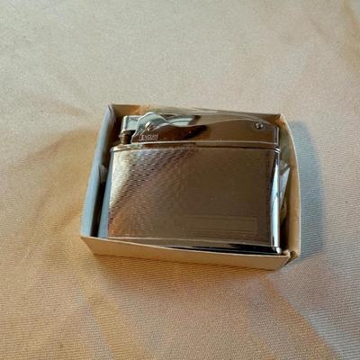 POCKET KNIVES, BUTANE LIGHTER AND A TAPE MEASURE