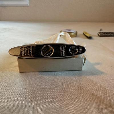 POCKET KNIVES, BUTANE LIGHTER AND A TAPE MEASURE