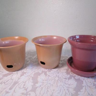 2 plastic self-watering pots, 1 ceramic pot with saucer
