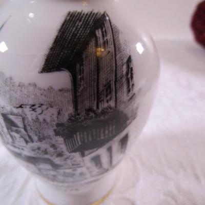Small bud vase with cityscape on it