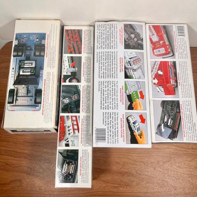 Lot 20B: Hess Trucks w/ Boxes - Rescue Truck, Fire Truck, Emergency Truck w/ Rescue Vehicle & Toy Truck and Race Car