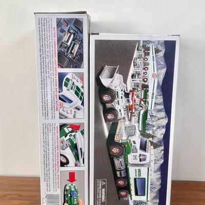 LOT 29B: Hess Trucks w/ Boxes - Toy Truck and Front Loader, Race Car and Racer & Toy Truck and Helicopter (2)