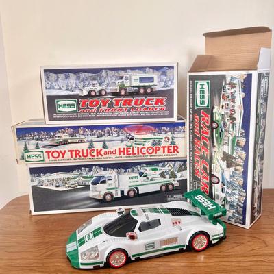 LOT 29B: Hess Trucks w/ Boxes - Toy Truck and Front Loader, Race Car and Racer & Toy Truck and Helicopter (2)