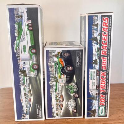 LOT 30B: Hess Trucks w/ Boxes - Monster Truck w/ Motorcycles, Toy Truck and Jet & Toy Truck and Racecars