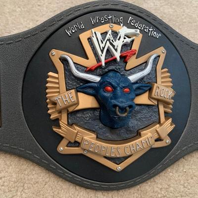 LOT 69 A: Children's Foam WCW & 1998 & 1999 Jakks WWF Replica Belts