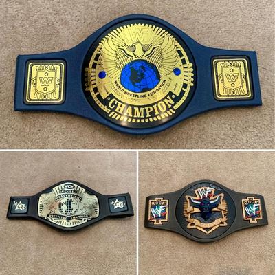 LOT 69 A: Children's Foam WCW & 1998 & 1999 Jakks WWF Replica Belts