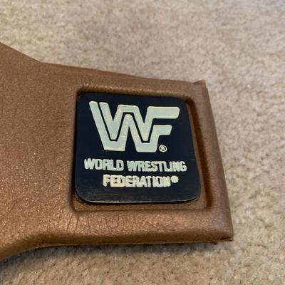 LOT 71 A: Children's Foam WCW & WWF Replica Belts