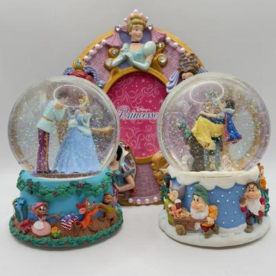 LOT 97A: Disney Princess Collection - Enesco Christmas Musical Snowglobes (Snow White & Cinderella) & Photo Frame