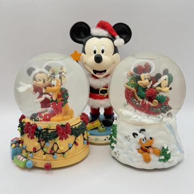 LOT 103B: Disney Kurt S Adler Mickey as Santa Christmas Nutcracker & Disney Christmas Snowglobes - "Sleigh Ride" &...