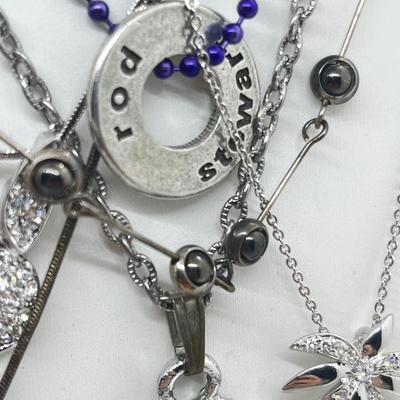 LOT 183J: Eclectic Silvertone Necklace Collection: Playboy Bunny, Rod Stewart, Liberty Bell and More