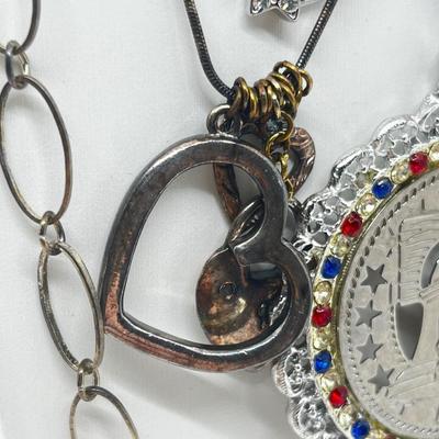 LOT 183J: Eclectic Silvertone Necklace Collection: Playboy Bunny, Rod Stewart, Liberty Bell and More