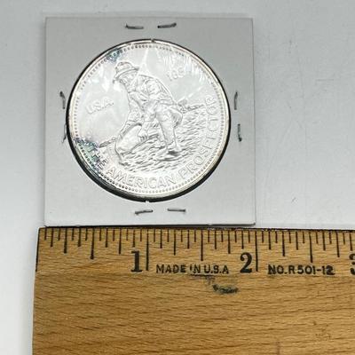 LOT 196J: 1984 Englehard One Ounce .999 Fine Silver American Prospector Coin