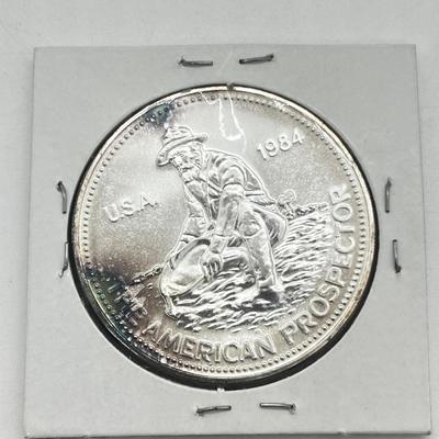 LOT 196J: 1984 Englehard One Ounce .999 Fine Silver American Prospector Coin
